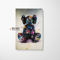 an elephant with colorful paint splattered all over it