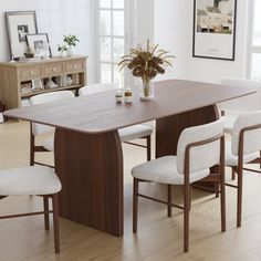 a dining room table with chairs around it