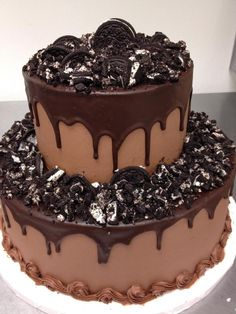 a cake with chocolate frosting and oreo cookies on top is shown in an instagram