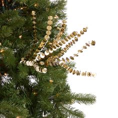 a christmas tree with ornaments hanging from it's branches