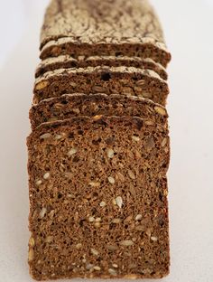 sliced loaf of bread sitting on top of a white counter