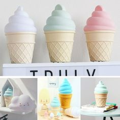 there are four different ice cream cones on the shelf and one is pink, blue, white