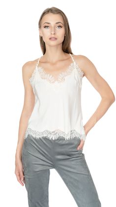 Wear this garment season after season, either on its own or layered. The patterned lace trim adds a soft feminine touch to this silk camisole, making it versatile for use as a beautiful intimate piece, a cute summer top, or a luxurious undershirt. It is made from 100% silk and is from the Gold Hawk brand. Dry cleaning is recommended for care. Cute Summer Tops, Shearling Vest, Soft Feminine, Silk Camisole, Poncho Cape, Cropped Cami, Leather Shorts, Denim Flares, Cotton Hoodie