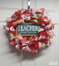 a teacher's wreath hanging on the front door