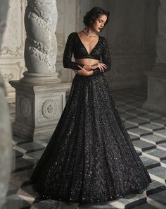 This lehenga set features black sequin embroidery on a dark nude base. It is paired with a full sleeves blouse and matching scalloped dupatta.From Seema Gujral's Inara collection. DELIVERY TIMEPlease allow 8-12 weeks for your outfit to arrive. FABRIC DETAILSNet Professional cleaning only. Seema Gujral Black Lehenga, Black Glitter Blouse Designs, Black Net Lehenga Designs, Black Sequin Lengha, Black Glitter Lehenga, Lengha Blouse Designs Full Sleeves, Black Shimmer Lehenga, Black Lehenga Designs, Black Colour Lehenga