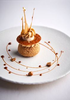 a small dessert is sitting on a white plate