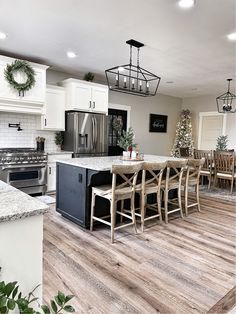 a kitchen filled with lots of counter top space next to a dining room table and chairs