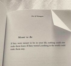 an open book with a piece of paper sticking out of it's center and the words meant to be