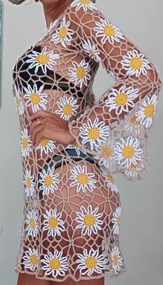 a woman in a short dress with flowers on it