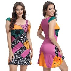 two women dressed in colorful dresses standing next to each other with their hands on their hips