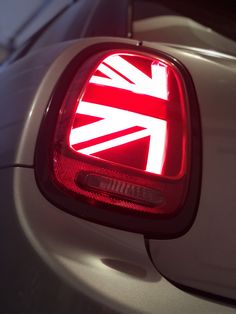 the tail light of a white car with an union jack on it