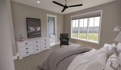 a bedroom with gray walls and white furniture