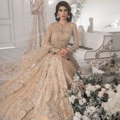 Beige Bridal Lehenga Maxi for Pakistani Wedding Dresses is an attractive dress to wear at the walima. This breathtaking attire is gracefully embellished with beige maxi lehenga and adornments giving a dreamy look to the Bride. The premium quality fabric of this perfectly stitched attire makes this Traditional Bridal Dress your foremost priority. Beige Lehenga Gown: Walking into a new chapter of your life with the joy of togetherness and the magic of love. NameerabyFarooq presents a walima outfit Tissue Gown, Walima Outfit, Beige Lehenga, Pakistani Gown, Pakistani Bridal Dress, Pakistani Clothes Online, Bridal Dupatta, Pakistani Designer Clothes, Attractive Dresses