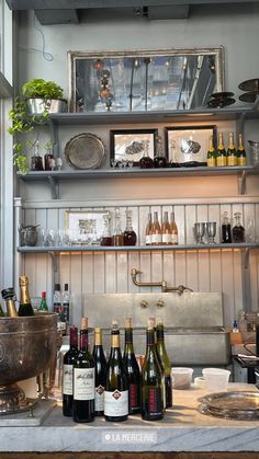 several bottles of wine are sitting on the counter