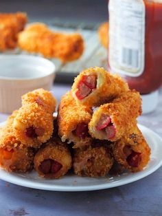 some food is stacked on top of each other with ketchup in the background