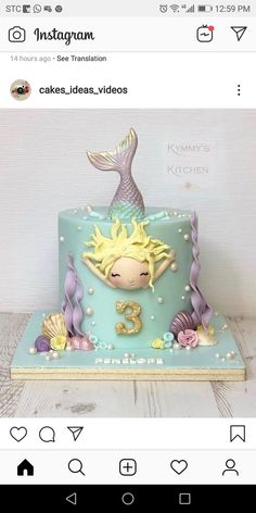 a cake decorated with an image of a mermaid