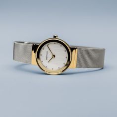 Classic, puristic, and yet exciting. Perfect style combined with contemporary minimalism. Inspired by Danish design, the CLASSIC COLLECTION represents a unique timepiece, perfectly highlighting your daily style.  The polished gold colored stainless steel case, made of pure, high quality, medical-grade stainless steel (316L), in combination with the modern silver colored milanese strap, provides the classic BERING look. The fine workmanship of the milanese strap gives the watch a refined, almost Brown Watches, Silver Water, Classic Watches, Bespoke Jewellery, Daily Style, Perfect Style, Gold Case, Style Classique, Color Oro