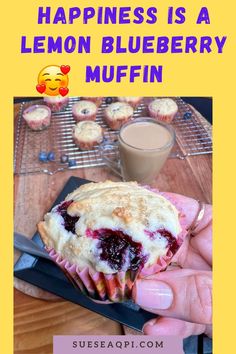 a person holding a muffin in their hand with the caption happiness is a lemon blueberry muffin