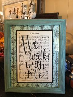 a framed art piece with the words we walk with me written in cursive writing