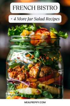 A French bistro-style jar salad layered with lettuce, roasted chicken, and vibrant vegetables. French Bistro