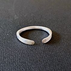 This silver adjustable open ring is easy to slip over knuckles. Great for stackable Wear alone or stack with other rings. The ring is made of square wire and tapered on both end to give it a beautiful geometric, minimalist look. + most common size for women is 5-7. adjustable open ring makes 6 an ideal size. + find your ring size ( http://www.ringsizes.co/). + packaged in a gift box and makes great gifts for birthday, anniversary, or holiday ∙ ∙ ∙ ∙ ∙ ∙ ∙ ∙ ∙ ∙ ∙ ∙ ∙ ∙ ∙ ∙ ∙ ∙ ∙ ∙ ∙ ∙ ∙ ∙ ∙ ∙ ∙ Gifts For Birthday, Cuff Ring, Cuff Rings, Ring Dainty, Open Ring, Stackable Rings, Fine Silver, Silver Band, Mother's Day Gift