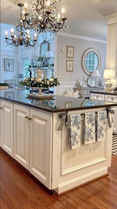 a kitchen island with towels hanging on it