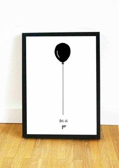 a black and white poster with an image of a balloon hanging from it's side