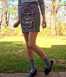 This listing is for an upcycled mini skirt - materials used: thrifted black and white plaid skirt from brand Eyeshadow, and misfits logo taken from an old band shirt. I hand stitched the front with bold, red embroidery thread.  Brand: Eyeshadow Size: 00 (xs) Measurements taken flat -  11.5" width at smallest point (23" waist) 16" width at widest point (32" hips) 15" length 3" slits on sides 5" zipper length If you are outside of the US and would like to purchase this listing, please message me with your location so I can list an accurate shipping price. And for any other questions, feel free to contact me and I will respond ASAP Fitted Grunge Mini Skirt For Streetwear, Alternative Fitted Mini Skirt For Streetwear, Grunge Mini Skirt For Streetwear, Alternative Style Mini Skirt For Fall, Casual Mini Skirt For Alternative Fashion, Grunge Cotton Mini Skirt For Fall, Casual Fall Skirt For Alternative Fashion, Casual Upcycled Denim Skirt, Casual Black Mini Skirt For Festival