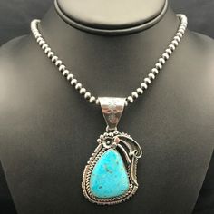 Navajo Sterling Silver Kingman Turquoise Necklace Pendant Yazzie Length 20 3203 The Native American Blue Kingman Turquoise Necklace And Pendant Has A Beautiful Matrix, With A Strand Of Silver Beads Add This Signed Pendant Necklace A Class Of Its Own. Free Gift Velvet Pouch With Purchase. Jewelry Type: Necklaces Length: 20" Pendant: 1.5” X 3” With Bail Main Stone: Turquoise Material: Stone Metal: Sterling Silver Artisan: Bennett And Dreama Yazzie Made In Usa Western Blue Concho Necklace, Blue Western Style Concho Necklace, Southwestern Blue Concho Necklace, Southwestern Style Blue Concho Necklace, Necklaces Length, Silver Necklace Pendant, Kingman Turquoise, Velvet Pouch, Sterling Silver Necklace Pendants