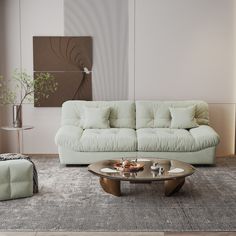 a living room with a couch, coffee table and two stools in front of it