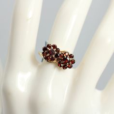 Vintage Garnet Cluster Ring 9k Yellow Gold Flower Cocktail The Ring Face is 12.53mm across by 17.72 mm wide by 4.93mm in height Red Garnets Estimated weight 1.25ct Size 7.75 can be sized at a low cost Ring weight 2.4 grams Comes with a new gift box Formal Red Flower Ring, Formal 14k Gold Flower Cluster Ring, 1940s Ring, The Ring Face, Vintage Gold Rings, Gold Cocktail Ring, Vintage Diamond Rings, Gold Cocktail, Makeup Makeover