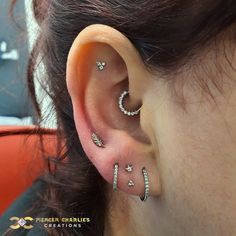 a close up of a person with ear piercings on their left and right ears