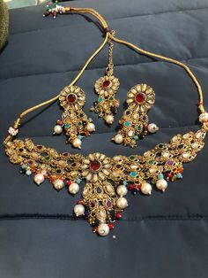 Adorable, effortless minimal and unique! A complete guide to cute outfits and style lover aesthetics❤️ This one is made for a charmer like you with all the love from Noorzaracollection! This beautiful Indian kundan multi stones necklace, drop earrings and mang tikka set is ready to ship. Color : multi, Hand crafted and gold plated kundan indian/pakistani jewelry Material:brass,stone,gemstone,pearl We bring you casual as well as party wear jewelry which comes with an attractive design and style. Elegant Multicolor Latkans Necklace, Bohemian Kundan Necklace With Tilla For Diwali, Elegant Multicolor Kundan Necklace For Navratri, Elegant Multicolor Kundan Necklace With Tilla, Elegant Multicolor Kundan Necklace For Eid, Bohemian Kundan Chandbali Jewelry Sets, Bohemian Kundan Jewelry Sets With Stone Work, Bohemian Kundan Necklace With Stone Work, Bohemian Kundan Jewelry Sets With Meenakari