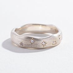 Reminiscent of the night sky, Angela Monaco's Starry Night ring has just the right amount of twinkle. This ring contains 8 pavé-set diamonds, scattered along the front length of the band. The brushed metal effect makes this ring versatile enough to wear alone, stacked, or paired as a wedding set. Available in brushed Sterling Silver or Yellow Gold Vermeil. Details Brushed Sterling Silver and Brushed 14K Yellow Gold Vermeil (8) white diamonds Constellation Ring, Clay Silver, Ring Inspo, Jewelry Lookbook, The Night Sky, Wedding Set, Brushed Metal, Men's Ring, Girly Jewelry