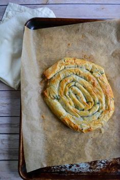 a pastry sitting on top of a piece of wax paper