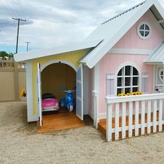 a toy house with a slide in the sand