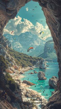 a group of people flying kites over a body of water near rocky cliffs and mountains