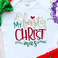 This is an adorable Christmas outfit. This outfit features a bodysuit with the words ”My First Christmas" on it. The outfit is complete with a matching red headband and shorts. Other bottoms/headbands are available in my shop as well to choose from.HOW TO ORDER:1. Bodysuit-Select Style and Size from the drop down and add to cart (S/S=Short Sleeve, L/S=Long Sleeve).2. Add bottom and headband to complete the outfit for best value (optional).3. Complete purchase and enjoy. ***All orders are custom First Christmas Traditions, Holiday Photo Shoot Ideas, First Christmas Onesie, Baby Tutu Outfits, Holiday Photo Shoot, Dry Legs, Holiday Baby Shower, Christmas Tutu, First Christmas Baby