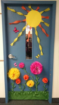 a door decorated with paper flowers and sun