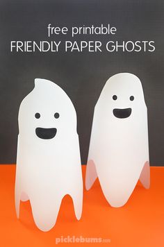 two paper ghost standing next to each other with the words free printable friendly paper ghosts