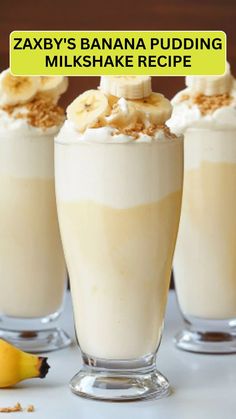 three glasses filled with banana pudding and whipped cream