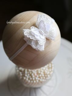 Off white bow measuring approximately 3 1/4" at widest with the butterfly made with embroidered lace, chiffon and oval pearl. Perfect little hair accessory for your little one! ⏰ IN A HURRY? NEED YOUR ORDER FAST? Add the "Rush my Order" listing (click below) in your cart when checking out. By purchasing the "Rush my Order", your order will be completed within 48-72 hours. Please note, "Rush my Order" is only for production time and does not speed up shipping time. You must select priority or exp White Matching Headband For Baptism, White Hair Accessories With Matching Headband For Baptism, Adjustable White Lace Hair Accessories, White Bow Headband For Wedding, White Butterfly Knot Hair Accessories For Gift, Cute Adjustable Headband For Wedding, Cute Adjustable Headband For Weddings, White Wedding Headband With Bow, White Lace Wedding Headband