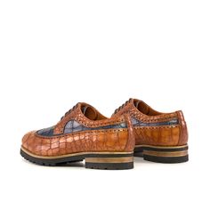 Similar to a Full Brogue, the Long Wingtip Blucher is unique in that one brogue panel extends from the toecap all the way to the heel of the shoe. Like a Full Brogue, the Long Wingtip Blucher is a classic style suitable for formal occasions and office wear alike. The Details: Materials: cognac painted croco + navy painted croco Lining: orange calf leather Sole: black comando sole Last: Zurigo - Rounded toe for fraditional English Look The Fine Print: Shoe production timeline/shipping can vary fr Artistic Shoes, Custom Made Shoes, Shoe Crafts, Men's Dress Shoes, Crocodile Print, High Quality Shoes, How To Make Shoes, Dress Shoes Womens, Goodyear Welt