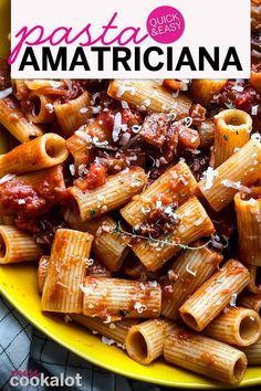 pasta with sauce and parmesan cheese in a yellow bowl