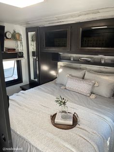 a bedroom with a bed and microwave in it