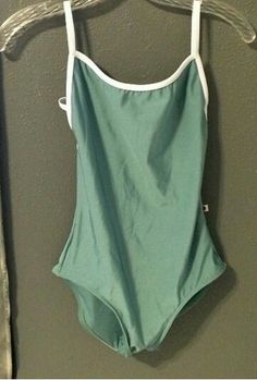 a woman's swimsuit hanging on a hanger