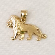 14K Yellow Gold Lion Pendant This Pendant is crafted from Solid 14K Yellow Gold and comes Polished-finish. Dimension is 7/8 in x 9/16 in (21 mm x 14 mm). The measurement is not including the bale. Weight Approx. is 2.00g Material  14K Yellow Gold Metal Type 14K Yellow Gold The quality is excellent. A perfect gift. Gold Whale, Lion Pendant, Gold Lion, Moon Pendant, Sterling Silver Necklaces, Pendant Necklaces, Charm Pendant, Types Of Metal, Halloween Shopping