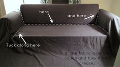 a couch that has been covered with a black cover and arrows pointing to the right