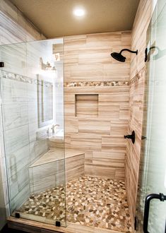 a walk in shower sitting inside of a bathroom