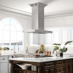 a kitchen with an island, stove and sink in it's centerpieces